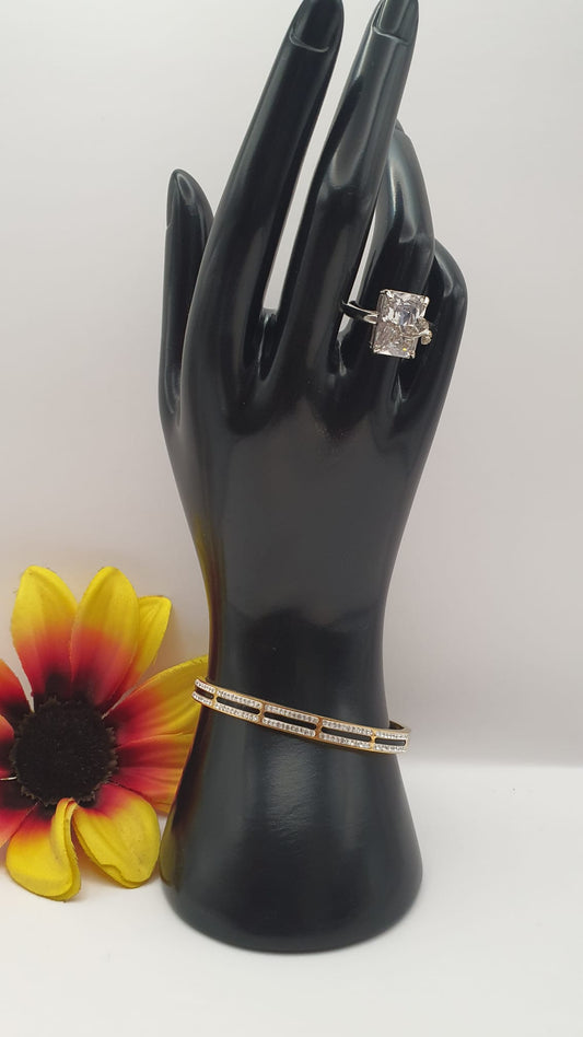 Crystal Diamond Ring with Black Shade and Golden Bangel Bracelet.